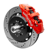 Wilwood red six-piston front caliper beside a 14-inch drilled-and-slotted rotor, separate hat and projecting hub for the CPP Tri-Five 14-inch AERO6 front installation