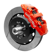 Wilwood red six-piston front caliper beside a 14-inch slotted rotor, separate hat and projecting hub for the CPP Tri-Five 14-inch AERO6 front installation