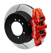 Wilwood red AERO4-DS caliper beside a 14.25-inch slotted rotor with its integral parking hat for the Patrol Y61 rear arrangement