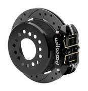 Wilwood black low-profile Dynapro rear caliper beside an assembled 11-inch drilled-and-slotted parking-hat rotor for the Small Ford 2.66-inch-offset rear interface