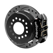 Wilwood black low-profile Dynapro rear caliper beside an assembled 11-inch drilled-and-slotted parking-hat rotor for the Small Ford 2.50-inch-offset rear interface