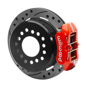 Wilwood red low-profile Dynapro rear caliper beside an assembled 11-inch drilled-and-slotted parking-hat rotor for the Small Ford 2.50-inch-offset rear interface