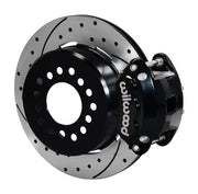 Wilwood black D154 rear caliper beside an assembled 12.19-inch drilled-and-slotted parking-hat rotor for the GM 12-bolt forward-caliper rear interface