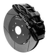 Wilwood SX6R front brake kit, Corvette C7, 15-inch GT rotors: Assembled brake view with black SX6R caliper over a gt slotted rotor and black central hat; no projecting replacement wheel hub is shown.