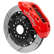 Wilwood TX6R front brake kit, Ram 1500 RWD, 16-inch GT rotors: Assembled brake view with red TX6R caliper over a gt slotted rotor and black central hat; no projecting replacement wheel hub is shown.