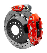 Wilwood Superlite 4R rear brake kit, Big Ford new-style 2.50-inch offset, 12.88-inch SRP rotors: Assembled rotor view with a red hydraulic service caliper on the side and a separate red electronic parking caliper above it.