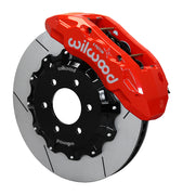 Wilwood TX6R front brake kit, F-150 SVT Raptor 2010–2014, 15.5-inch GT rotors: Assembled brake view with red TX6R caliper over a gt slotted rotor and black central hat; no projecting replacement wheel hub is shown.