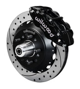 Wilwood Superlite 6R front brake kit, GM AFX ProSpindles, 12.88-inch SRP rotors: Assembled brake view with black Superlite 6R caliper, drilled & slotted rotor, black hat/adapter and projecting hub with wheel studs.