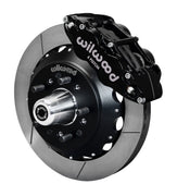 Wilwood Superlite 6R front brake kit, GM AFX ProSpindles, 12.88-inch GT rotors: Assembled brake view with black Superlite 6R caliper, gt slotted rotor, black hat/adapter and projecting hub with wheel studs.