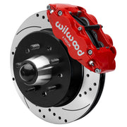 Wilwood Superlite 6R front brake kit, five-lug GM truck/SUV iron ProSpindles, 12.19-inch SRP rotors: Assembled brake view with red Superlite 6R caliper, drilled & slotted rotor, black hat/adapter and projecting hub with wheel studs.