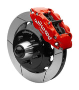 Wilwood Superlite 6R front brake kit, five-lug GM truck/SUV iron ProSpindles, 13.06-inch GT rotors: Assembled brake view with red Superlite 6R caliper, gt slotted rotor, black hat/adapter and projecting hub with wheel studs.