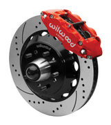 Wilwood Superlite 6R front brake kit, five-lug GM truck/SUV iron ProSpindles, 14-inch SRP rotors: Assembled brake view with red Superlite 6R caliper, drilled & slotted rotor, black hat/adapter and projecting hub with wheel studs.