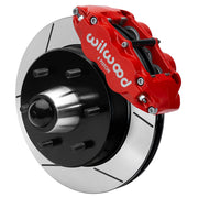 Wilwood Superlite 6R front brake kit, six-lug GM truck/SUV iron ProSpindles, 12.19-inch GT rotors: Assembled brake view with red Superlite 6R caliper, gt slotted rotor, black hat/adapter and projecting hub with wheel studs.