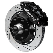 Wilwood Superlite 6R front brake kit, six-lug GM truck/SUV iron ProSpindles, 14-inch SRP rotors: Assembled brake view with black Superlite 6R caliper, drilled & slotted rotor, black hat/adapter and projecting hub with wheel studs.