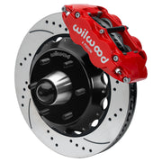 Wilwood Superlite 6R front brake kit, six-lug GM truck/SUV iron ProSpindles, 14-inch SRP rotors: Assembled brake view with red Superlite 6R caliper, drilled & slotted rotor, black hat/adapter and projecting hub with wheel studs.
