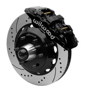Wilwood AERO6 front brake kit, six-lug GM truck/SUV iron ProSpindles, 14-inch SRP rotors: Assembled brake view with black AERO6 caliper, drilled & slotted rotor, black hat/adapter and projecting hub with wheel studs.