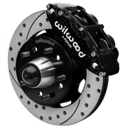 Wilwood Superlite 6R front brake kit, later GM truck/van/SUV iron ProSpindles, 12.19-inch SRP rotors: Assembled brake view with black Superlite 6R caliper, drilled & slotted rotor, black hat/adapter and projecting hub with wheel studs.