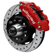 Wilwood Superlite 6R front brake kit, later GM truck/van/SUV iron ProSpindles, 12.19-inch SRP rotors: Assembled brake view with red Superlite 6R caliper, drilled & slotted rotor, black hat/adapter and projecting hub with wheel studs.