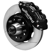 Wilwood Superlite 6R front brake kit, later GM truck/van/SUV iron ProSpindles, 12.19-inch GT rotors: Assembled brake view with black Superlite 6R caliper, gt slotted rotor, black hat/adapter and projecting hub with wheel studs.