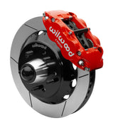Wilwood Superlite 6R front brake kit, later GM truck/van/SUV iron ProSpindles, 13.06-inch GT rotors: Assembled brake view with red Superlite 6R caliper, gt slotted rotor, black hat/adapter and projecting hub with wheel studs.
