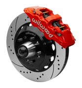Wilwood AERO6 front brake kit, later GM truck/van/SUV iron ProSpindles, 14-inch SRP rotors: Assembled brake view with red AERO6 caliper, drilled & slotted rotor, black hat/adapter and projecting hub with wheel studs.