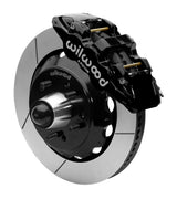 Wilwood AERO6 front brake kit, later GM truck/van/SUV iron ProSpindles, 14-inch GT rotors: Assembled brake view with black AERO6 caliper, gt slotted rotor, black hat/adapter and projecting hub with wheel studs.