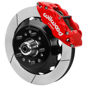 Wilwood Superlite 6R front brake kit, GM second-generation AFX ProSpindles, 12.88-inch GT rotors: Assembled brake view with red Superlite 6R caliper, gt slotted rotor, black hat/adapter and projecting hub with wheel studs.