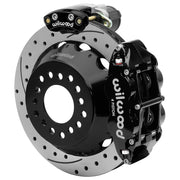 Wilwood Big Ford New Style 2.36-inch-offset axle rear assembly with a 12.88-inch drilled-and-slotted rotor, black Superlite 4R hydraulic service caliper and smaller electric parking caliper with motor housing