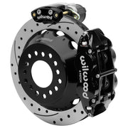 Wilwood Big Ford 2.36-inch-offset axle rear assembly with a 12.88-inch drilled-and-slotted rotor, black Superlite 4R hydraulic service caliper and smaller electric parking caliper with motor housing