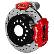 Wilwood Small Ford 2.50-inch-offset axle rear assembly with a 12.19-inch drilled-and-slotted rotor, red Dynalite hydraulic service caliper and smaller electric parking caliper with motor housing