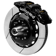 Wilwood black front caliper beside the assembled 14.00-inch slotted rotor for the GM G-Body and related disc-spindle brake conversion, with the hub and wheel studs visible