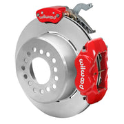 Wilwood red rear caliper beside the assembled 12.19-inch undrilled rotor for the Currie Pro-Tour drilled-pattern floater brake conversion, with a separate MC4 parking caliper