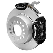 Wilwood black rear caliper beside the assembled 12.19-inch undrilled rotor for the Currie Pro-Tour drilled-pattern floater brake conversion, with a separate MC4 parking caliper