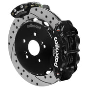 Wilwood black rear caliper beside the assembled 12.88-inch drilled and slotted rotor for the Honda S2000 electric parking brake conversion, showing the separate electric parking caliper