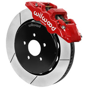 Wilwood red front caliper beside the assembled 14.00-inch slotted rotor for the 1994–2004 Ford Mustang brake conversion