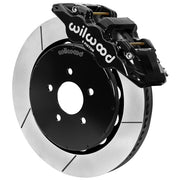 Wilwood black front caliper beside the assembled 14.00-inch slotted rotor for the 1994–2004 Ford Mustang brake conversion