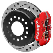 Wilwood red rear caliper beside the assembled 11.00-inch drilled and slotted rotor for the Ford Explorer 8.8 low-profile 2.54-inch offset brake conversion