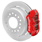 Wilwood red rear caliper beside the assembled 11.00-inch undrilled rotor for the Ford Explorer 8.8 low-profile 2.54-inch offset brake conversion