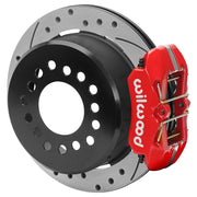 Wilwood red rear caliper beside the assembled 11.00-inch drilled and slotted rotor for the GM S10 low-profile 2.75-inch offset brake conversion