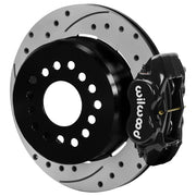 Wilwood black rear caliper beside the assembled 12.19-inch drilled and slotted rotor for the GM S10 Dynalite 2.75-inch offset brake conversion