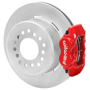 Wilwood red rear caliper beside the assembled 12.19-inch undrilled rotor for the GM S10 Dynalite 2.75-inch offset brake conversion
