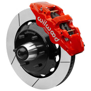 Wilwood red front caliper beside the assembled 14.00-inch slotted rotor for the Chevrolet/GMC six-lug AERO6 drop-spindle brake conversion, with the hub and wheel studs visible