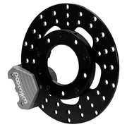 Wilwood gray anodized front caliper beside the assembled 10.00-inch drilled rotor for the Santhuff spindle-mount drag brake conversion