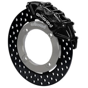 Wilwood black front caliper beside the assembled 11.25-inch drilled rotor for the Honda Talon UTV6 brake conversion