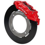 Wilwood red front caliper beside the assembled 11.25-inch undrilled rotor for the Honda Talon UTV6 brake conversion