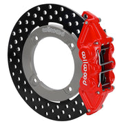 Wilwood red rear caliper beside the assembled 11.25-inch drilled rotor for the Honda Talon UTV4 brake conversion