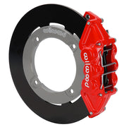 Wilwood red rear caliper beside the assembled 11.25-inch undrilled rotor for the Honda Talon UTV4 brake conversion
