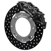 Wilwood black front caliper beside the assembled 11.25-inch drilled rotor for the Can-Am Maverick X3 UTV6 brake conversion