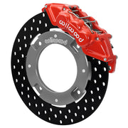 Wilwood red front caliper beside the assembled 11.25-inch drilled rotor for the Can-Am Maverick X3 UTV6 brake conversion