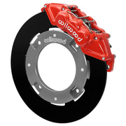 Wilwood red front caliper beside the assembled 11.25-inch undrilled rotor for the Can-Am Maverick X3 UTV6 brake conversion